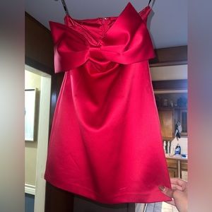 Red strapless cocktail dress with detailed bow in the front